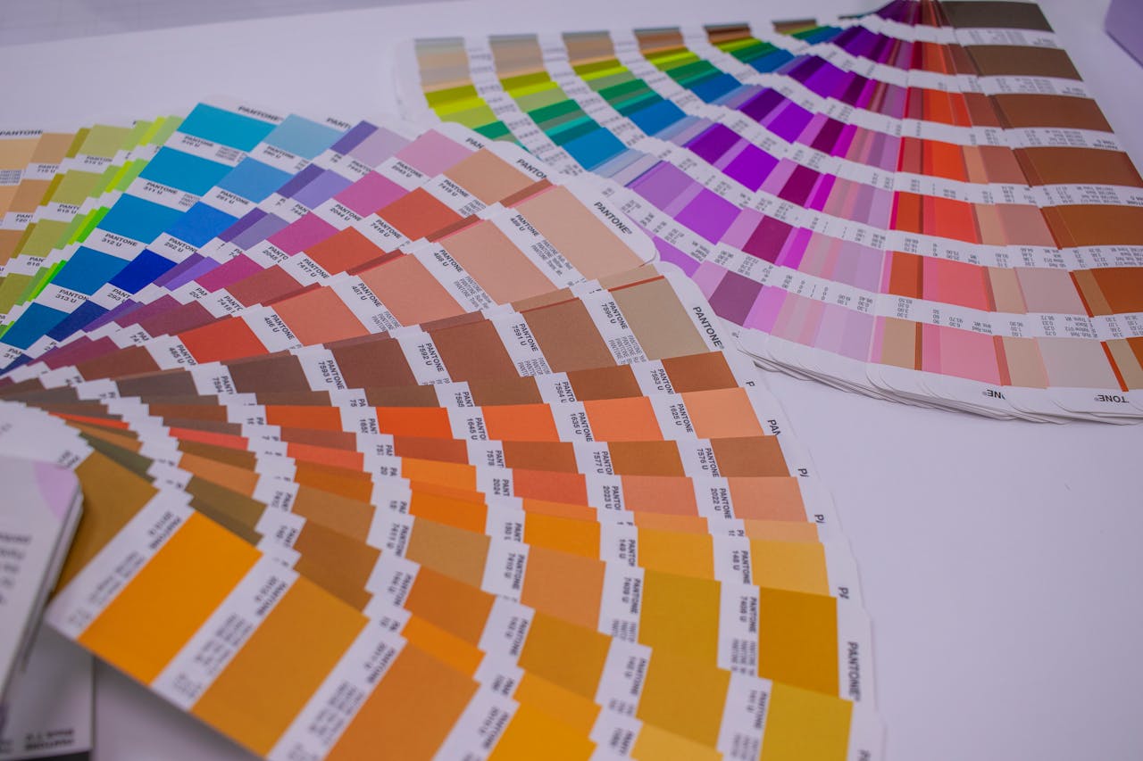 services-02 A collection of Pantone color swatches showcasing a wide range of vivid hues for designers.